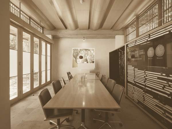 A boardroom table set for a meeting.